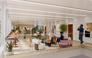 Moderne kantoorruimte te huur op Avenue Louise, Brussel, met stijlvolle gemeubileerde werkplekken en mensen bezig met zakelijke werkzaamheden. Heldere, uitnodigende omgeving in de Europese Wijk.